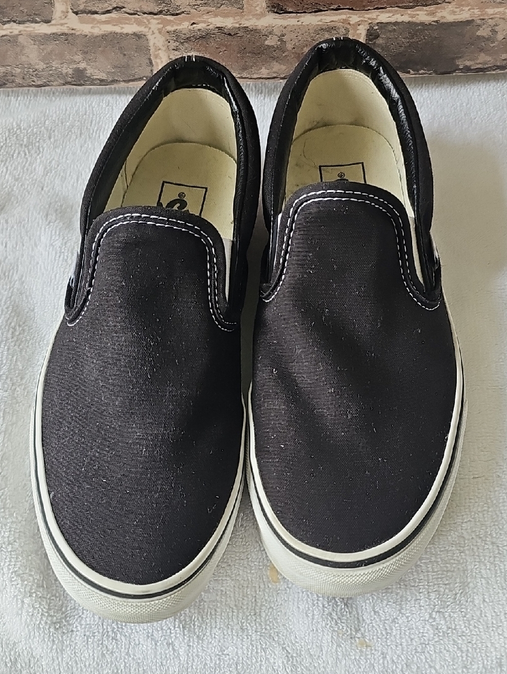 Vans Classic Slip-On Sneakers in Black and White